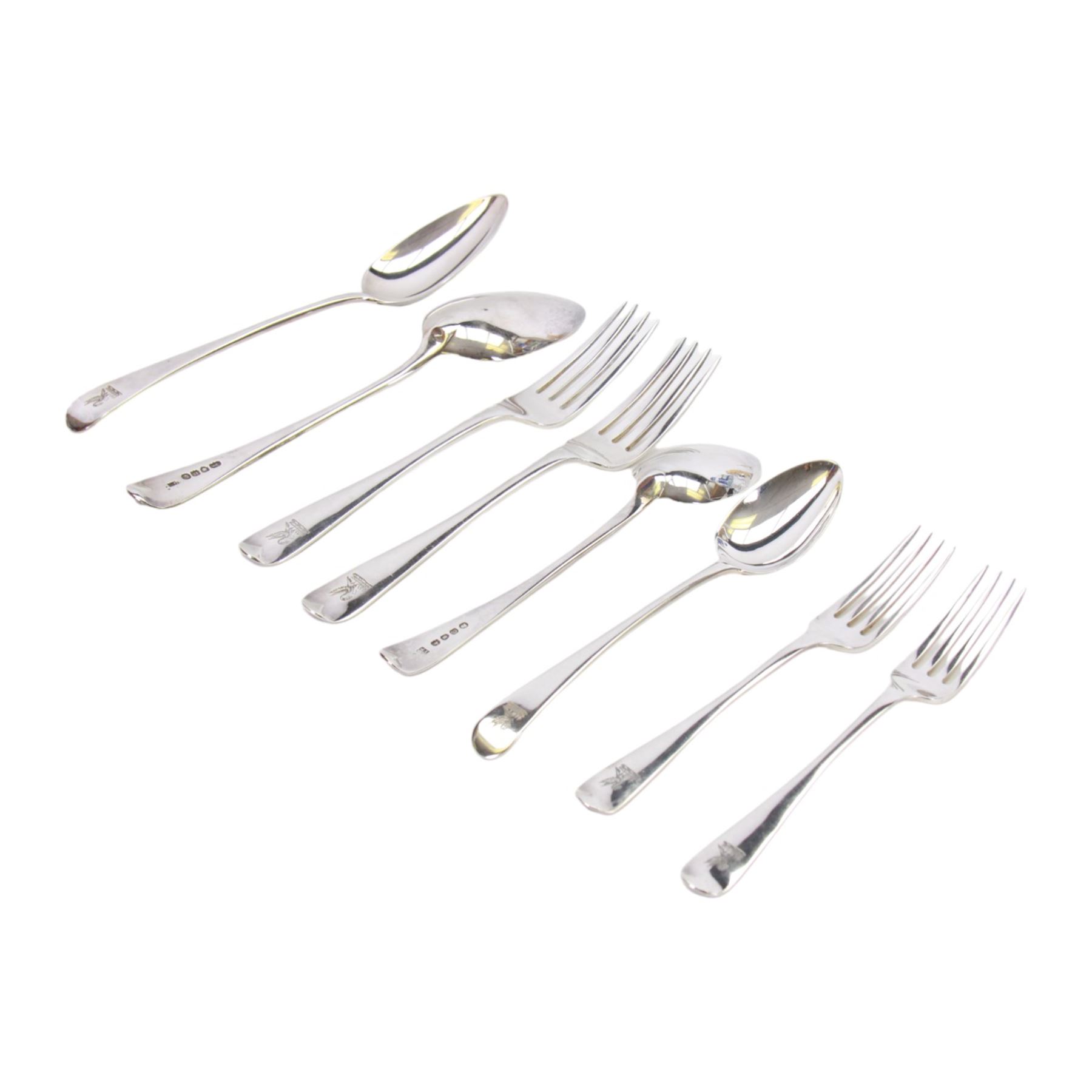 Georgian silver matched Old English pattern canteen for twelve place settings, comprising table spoons, table forks, dessert spoons, and side forks, hallmarked London, dates ranging from 1798 to 1828, various makers marks, contained within a later oak fitted box with engraved brass cartouche to the hinged cover
