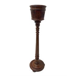 Inlaid hardwood plant stand, with carved decoration and scrolling metal inlays, turned stem on moulded circular platform base