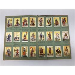 Magnus Laurie: The West Riding Territorials in the Great War. 1920: German Haus Neuerburg cigarette card album entitled Der Bunte Rock depicting 19th century military uniforms; French Chocolat Aiglon trade card album including some military costumes; and a cigarette card album, some of military interest (4)