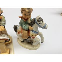 Twenty six Hummel figures by Goebel, to include Fire Fighter, Band Leader and Spring Sowing