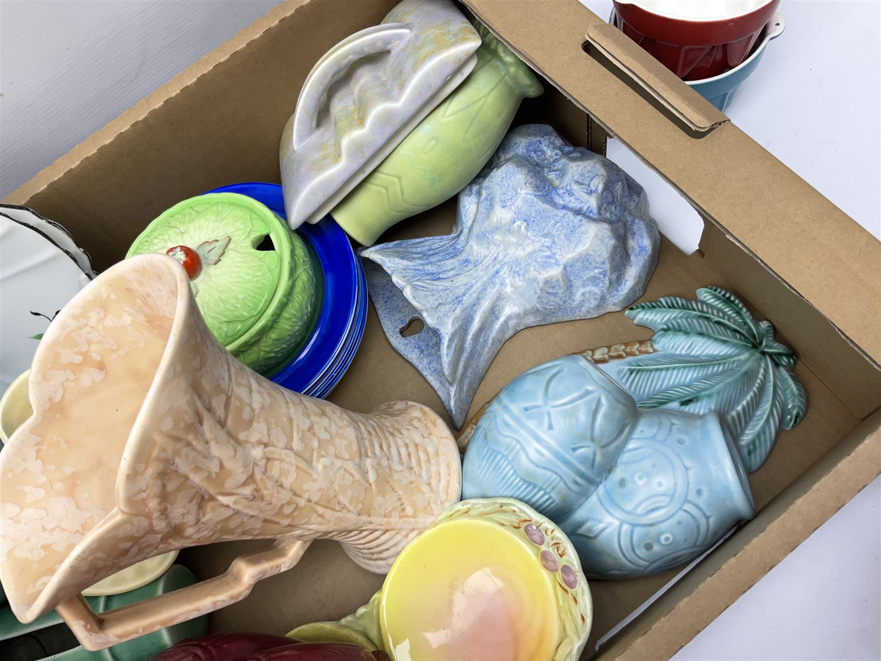 Two Beswick jugs decorated with palm trees, together with matching wall pockets, and similar ceramics, together with six Shelley dishes  