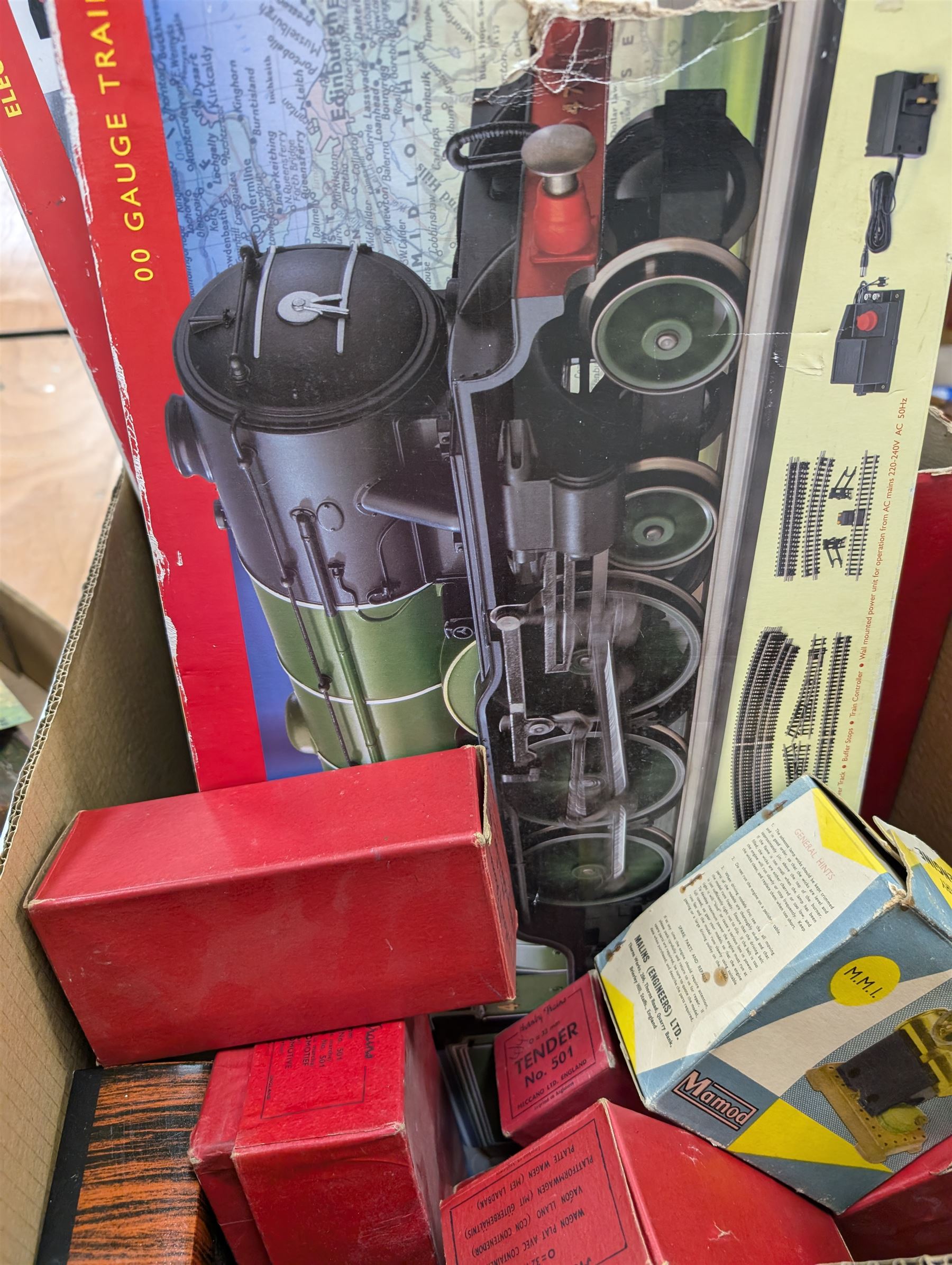 Collection of model railway buildings and other accessories, together with a box empty Hornby boxes, including three trainset boxes with pieces of track inside only
