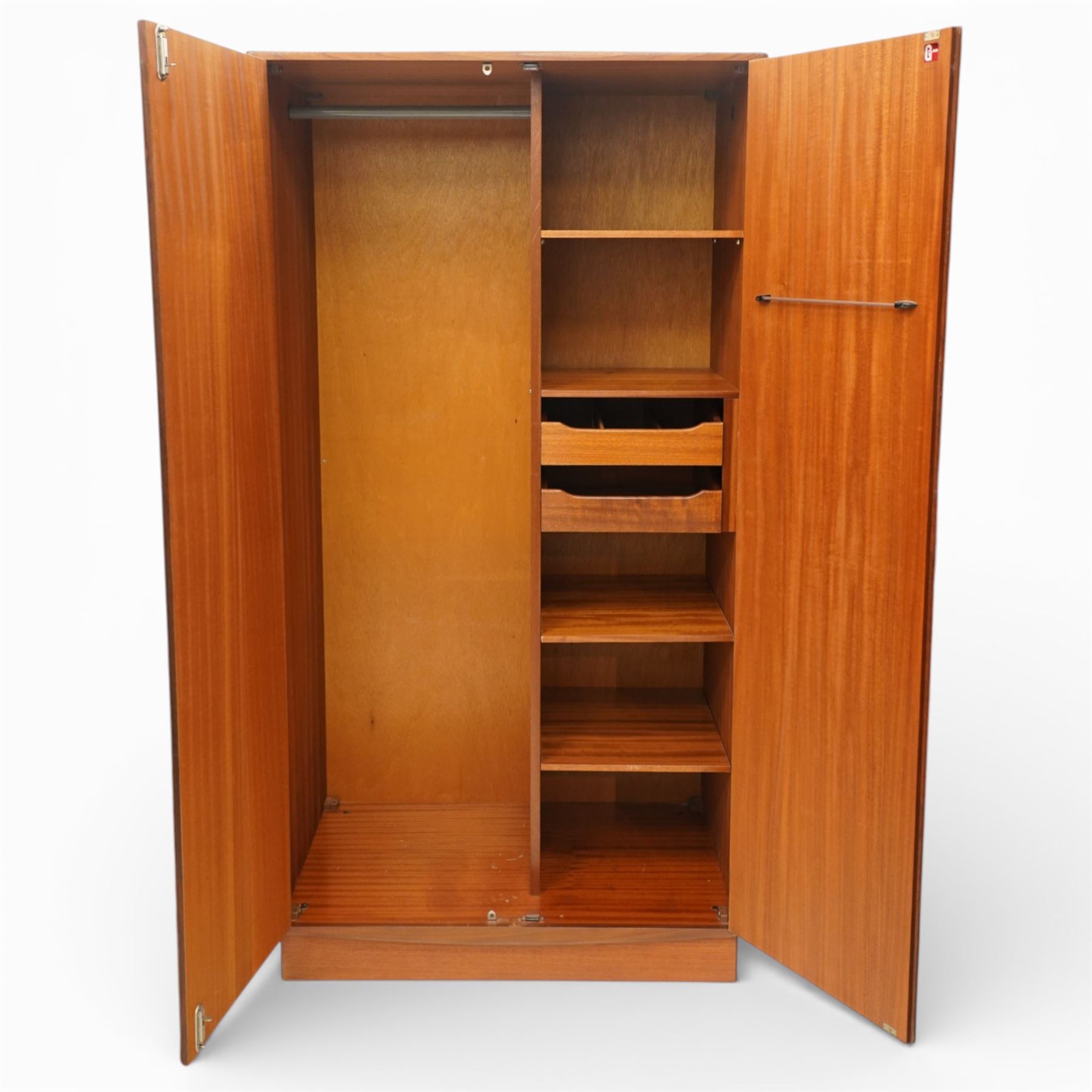G Plan - 'Fresco' teak double fitted gentleman's wardrobe, twin doors enclosing two sections, a single clothes rail and drawers and shelving, on a recessed plinth base