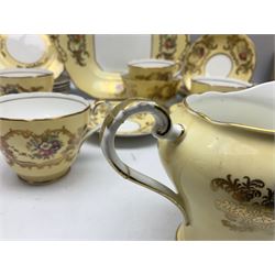 Aynsley tea service for six, decorated with floral sprays in ornate gilt detailing on cream ground, comprising six teacups and saucers, open sucrier and milk jug and cake plate, all with printed marks beneath