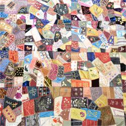 Victorian crazy pattern patchwork quilt, of irregular scraps, within a silk and lace border, L174cm, W134cm