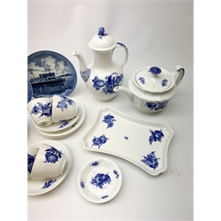 Royal Copenhagen tea wares, comprising teapot of canted form, coffee pot with bud finial, a small tray or sandwich plate, eight teacups and eight saucers, and a pin dish, all decorated with blue flowers upon a white ground, each with maker’s marks beneath, together with three further Royal Copenhagen plates. 