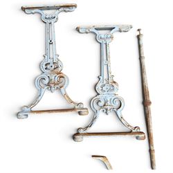 Assorted garden and architectural salvage, comprising a galvanised watering can, two long-handled cutting tools, metal pole, pair of ornate cast iron supports and further decorative fragments