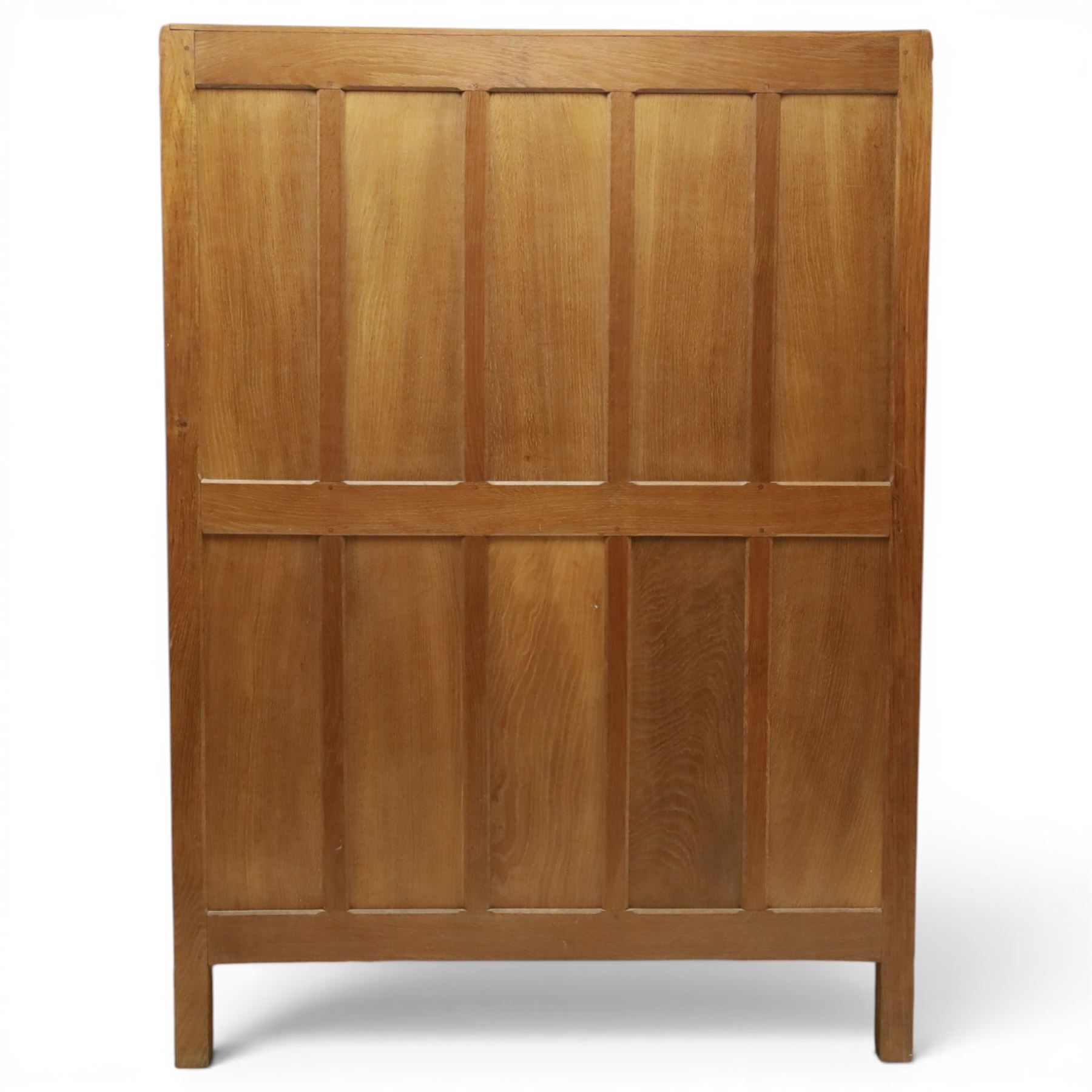 Mouseman - early-to-mid-20th century panelled and adzed double wardrobe, the arcade carved cresting rail over two panelled doors, with wrought metal hinges and latch, deep relief carved mouse signature, the interior fitted with hanging rail, by the workshop of Robert Thompson of Kilburn