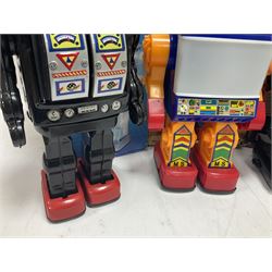 Three vintage battery operated robots comprising tin-plate Space Walk Man ME 100 Robot, Saturn the 13