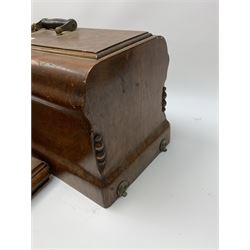 Two vintage sewing machines, the first marked Federation, in mahogany case, the second marked Singer, in oak case. 