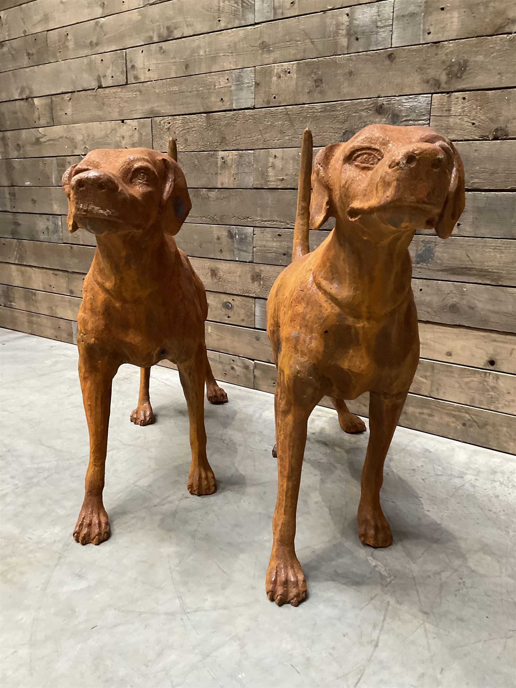 Pair of life-size heavy cast iron garden Hunting dogs