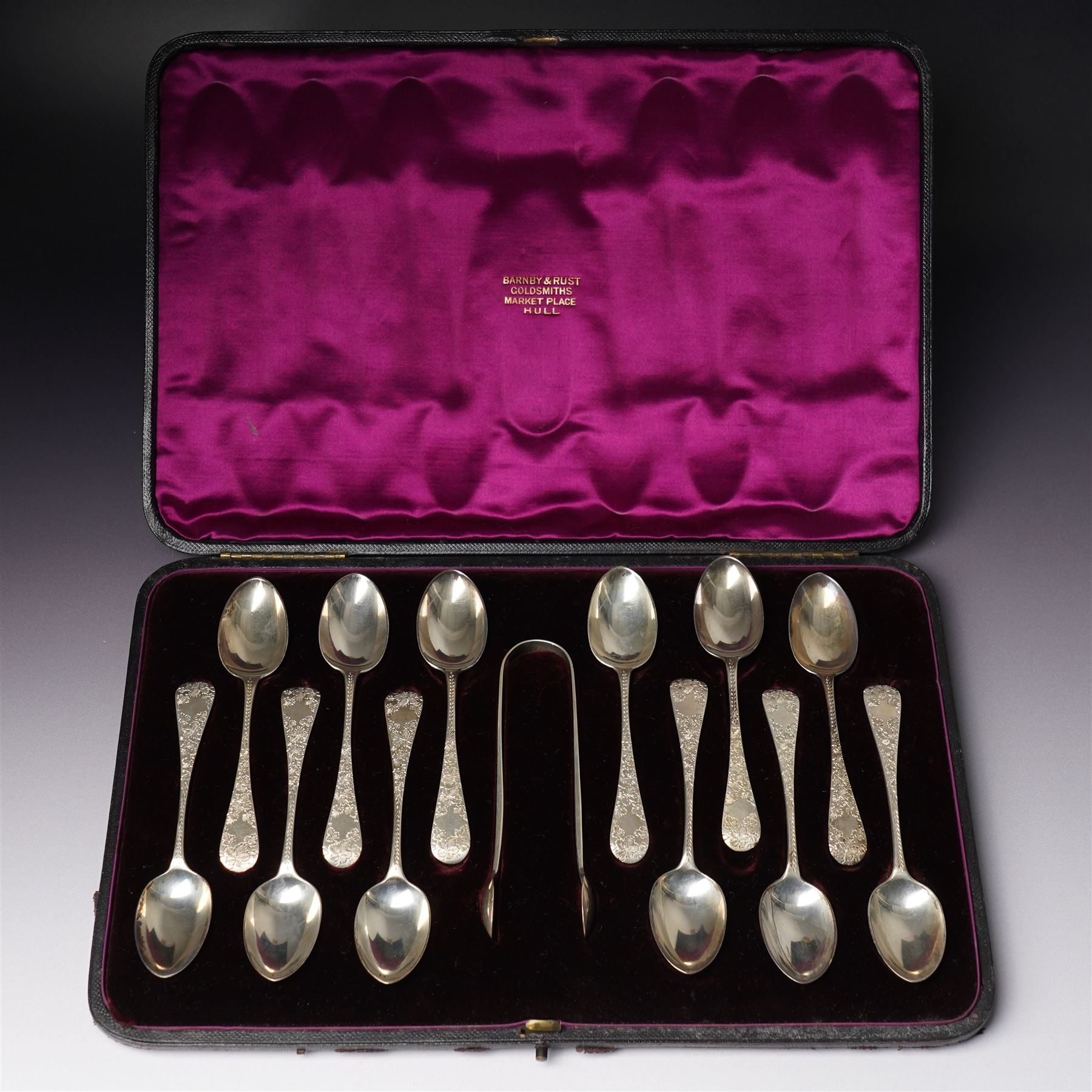 Cased set of twelve Victorian silver tea spoons and tongs with floral engraved stems London 1894 Maker Wakely & Wheeler