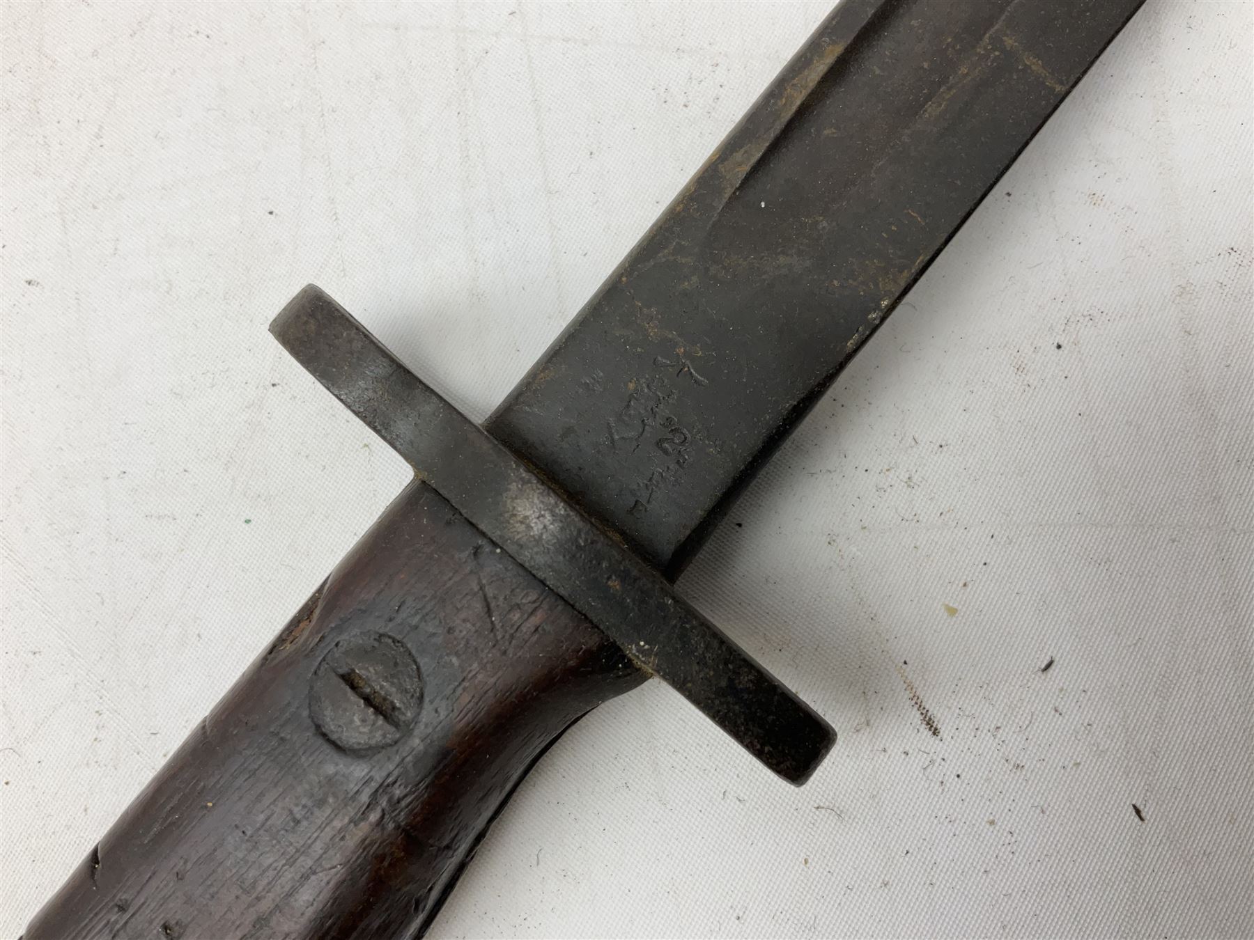 British Pattern 1907 bayonet with 43.5cm fullered steel blade; in leather scabbard with webbing frog L58cm overall; another Pattern 1907 bayonet lacking scabbard; and British Pattern 1888 Mk.I bayonet by Wilkinson London (no scabbard) (3)