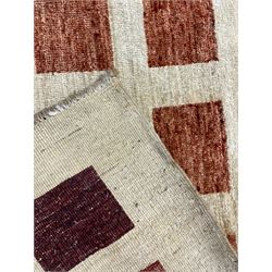 Contemporary camel ground woollen rug, decorated with gradient squares in shades of terracotta 