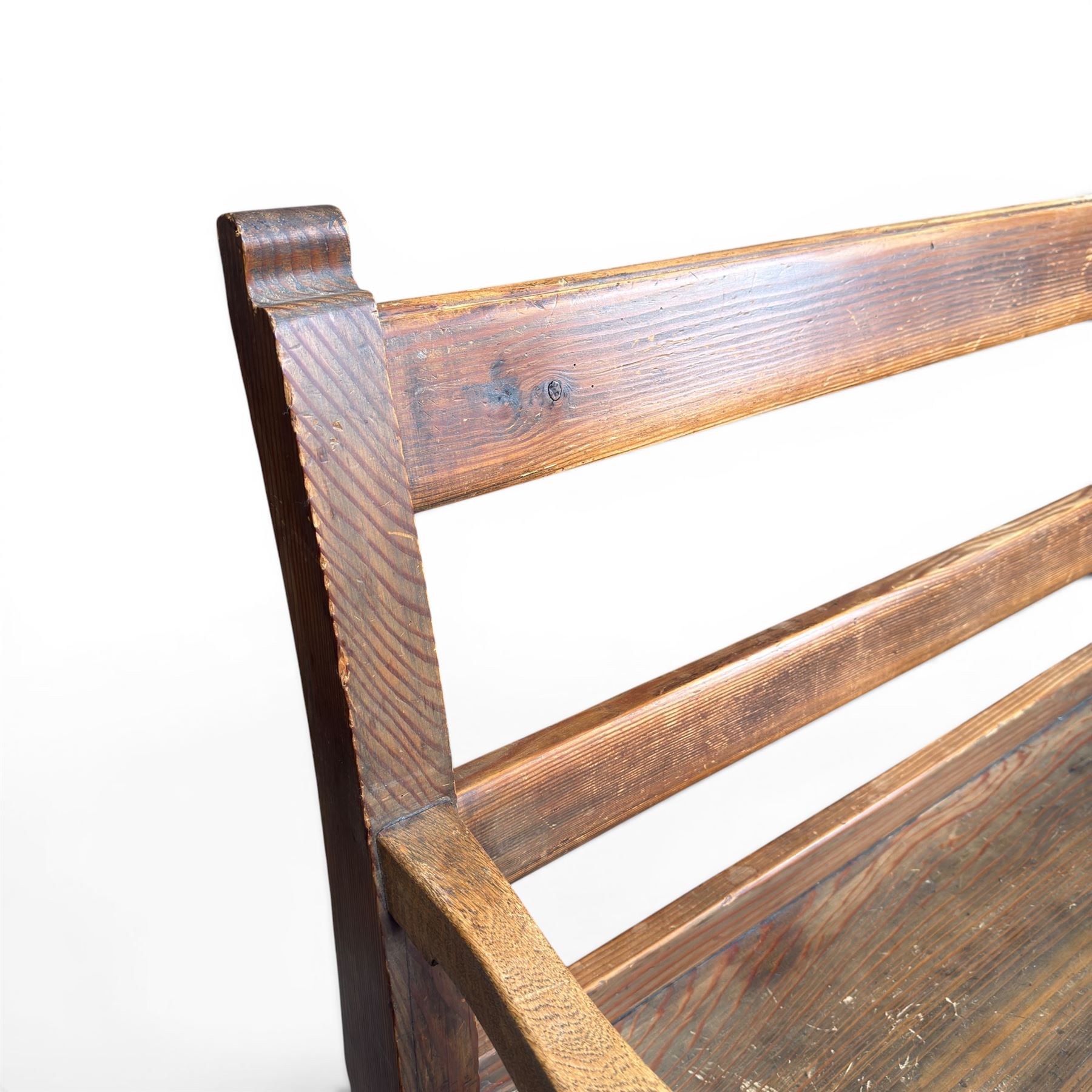 Early 20th century pine and oak bench seat, stained pine rail back frame with shaped oak arms