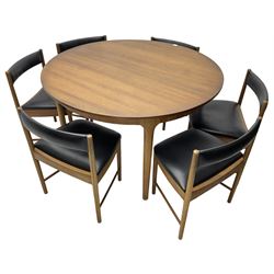 AH McIntosh & Co of Kirkaldy - mid-20th century teak extending dining table, circular top, concealed integrated double leaf, raised on tapered supports, label plaque to underside of leaf, together with a set of six chairs upholstered in black leatherette