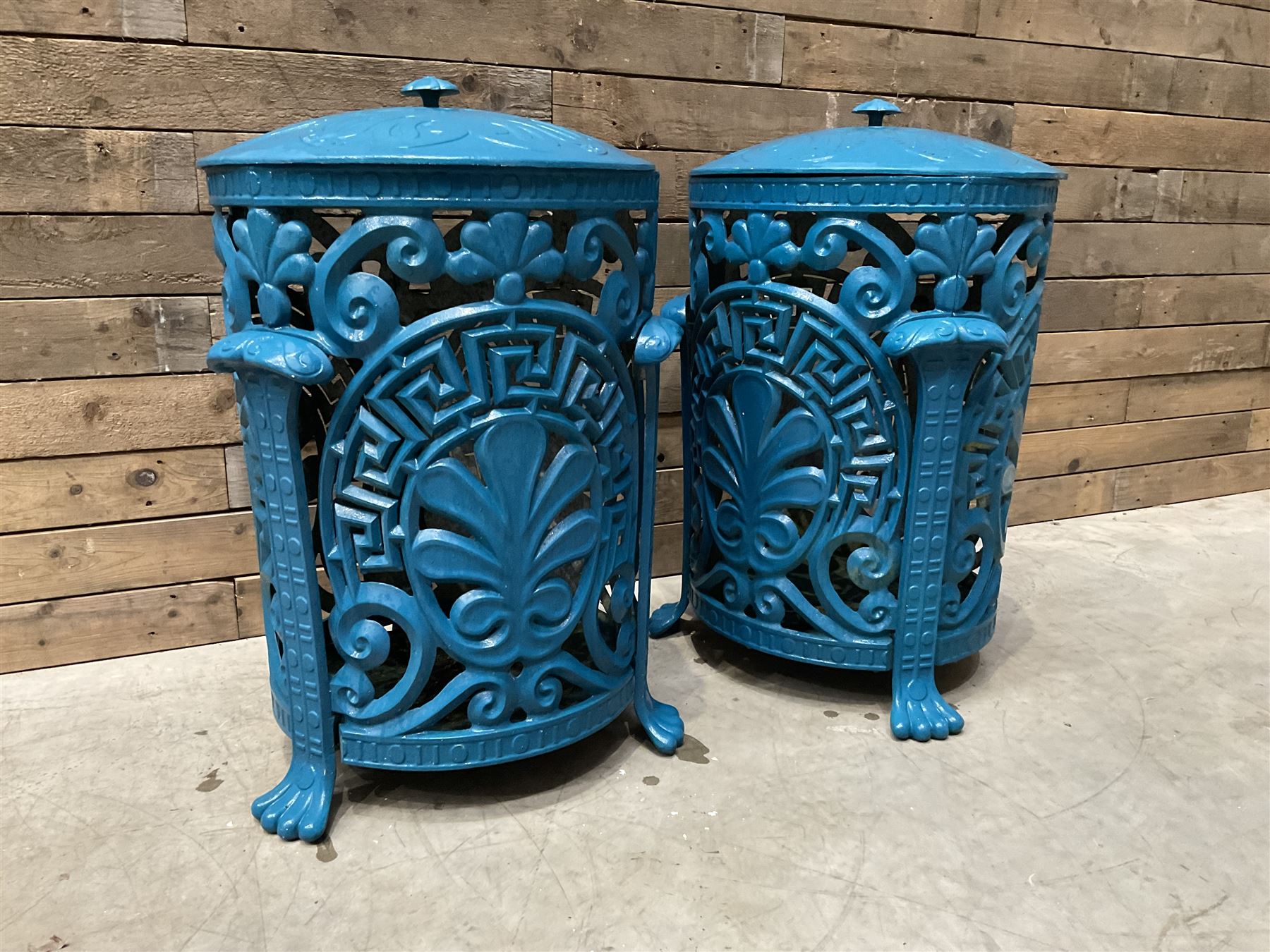 Pair of blue painted cast iron garden bins