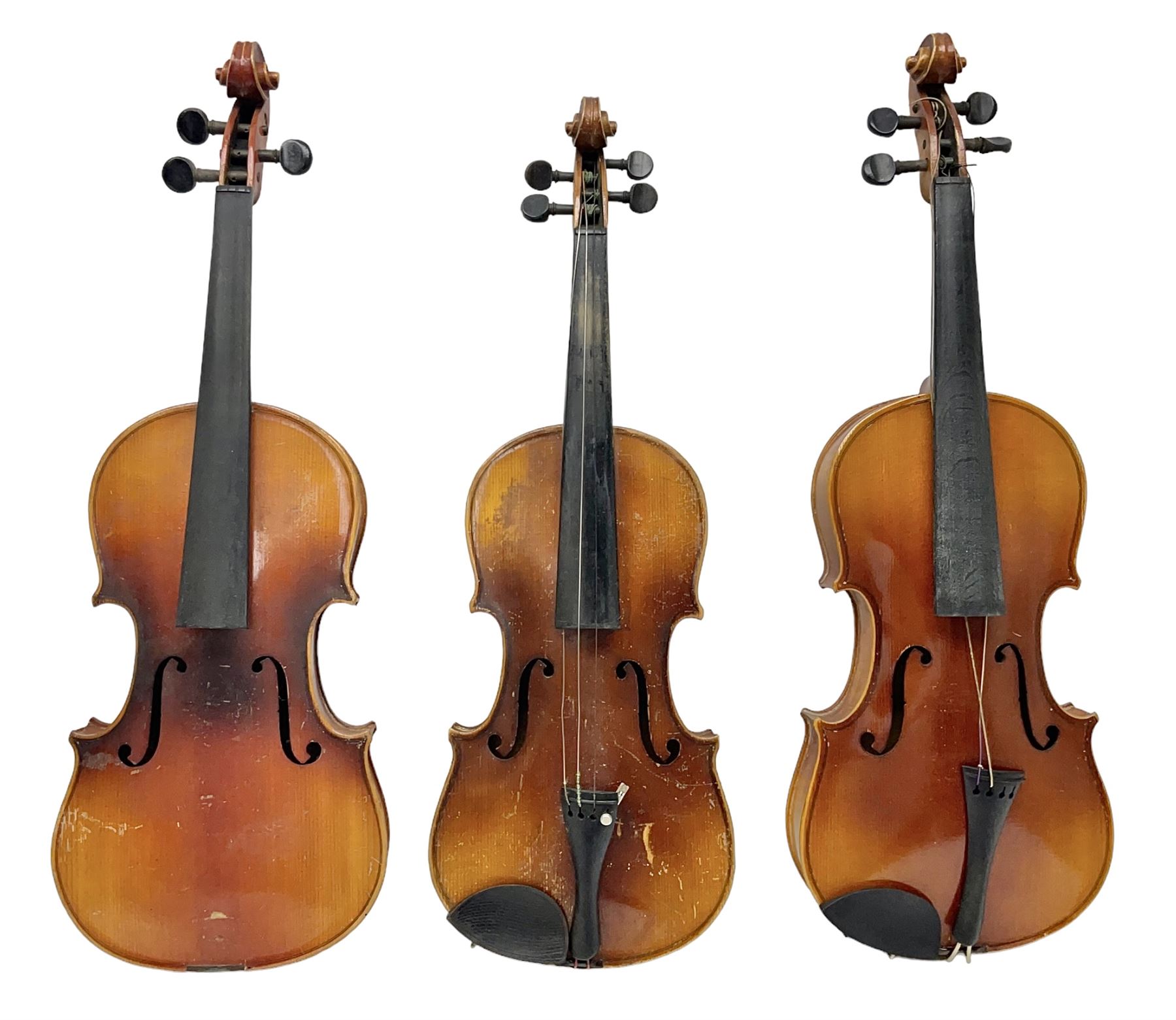 Czechoslovakian violin c1920 with 36cm two-piece maple back and ribs and spruce top, bears label 'Copy of Antonius Stradivarius Made in Czechoslovakia' L59cm; in carrying case; 1950s Czechoslovakian violin; and 195os Czechoslovakian three-quarter size violin; both cased (3)