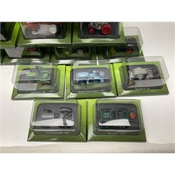 Eighteen issues of Tractors and The World of Farming magazine, together with sixty diecast tractors, all in original packaging, in three boxes 
