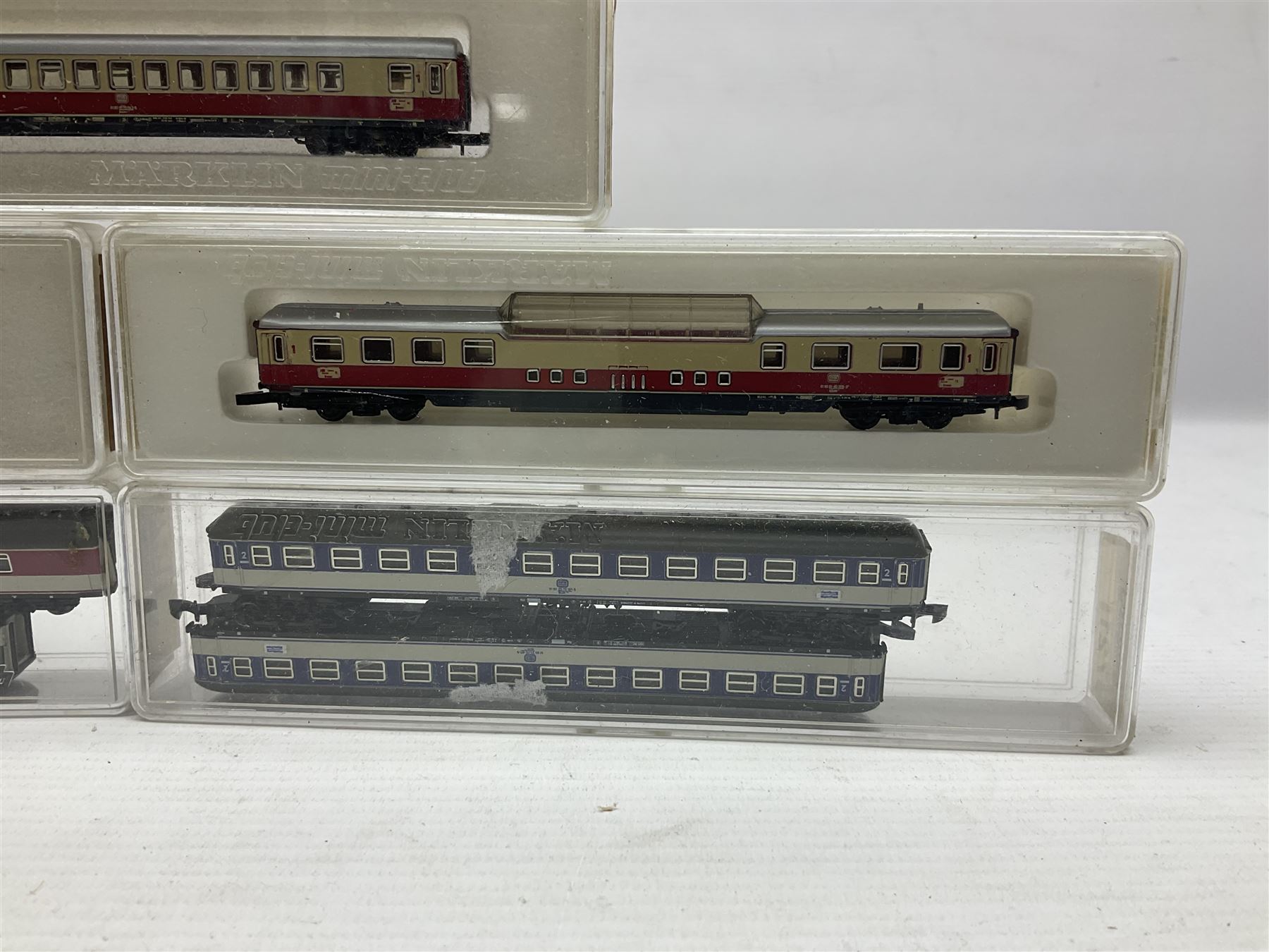 Marklin mini-club 'Z' gauge - twelve passenger coaches nos.8610, two 8611, 8613, 8700, two 8701, 8720, 8721, 8722, 8723 and 8725; together with four others in two unassociated boxes; all in hard plastic boxes (16)