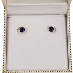 Pair of 9ct gold blue stone stud earrings, boxed