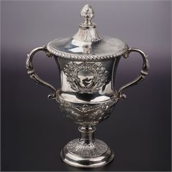 George III silver two handled campana shape cup and cover with pineapple lift, the body wi...