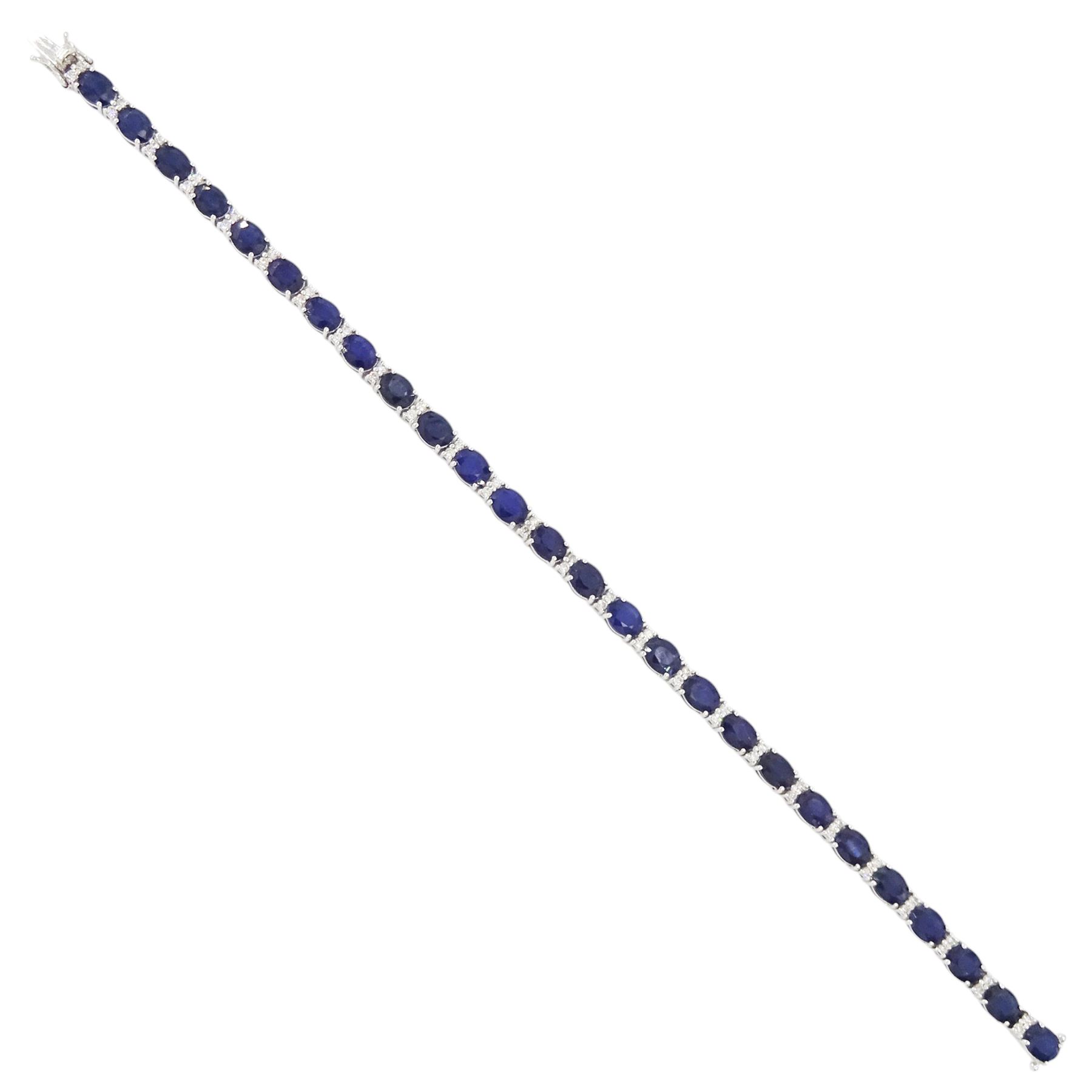 18ct white gold sapphire and diamond bracelet, twenty-six oval cut sapphires, each spaced by two round brilliant cut diamonds, stamped 750, total sapphire weight 10.60 carat, total diamond weight 0.46 carat
