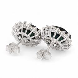 Pair of 18ct white gold sapphire and diamond cluster earrings, each stud set with a single oval cut sapphire, surrounded by sixteen round brilliant cut diamonds, total sapphire weight approx 6.65 carat, total diamond weight approx 1.00 carat