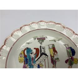 18th century Worcester Chinese Family pattern plate, circa 1765, of circular form with scalloped rim, the dished centre decorated in polychrome enamels with figures gathered around a table, within iron red line and dot borders, D19cm