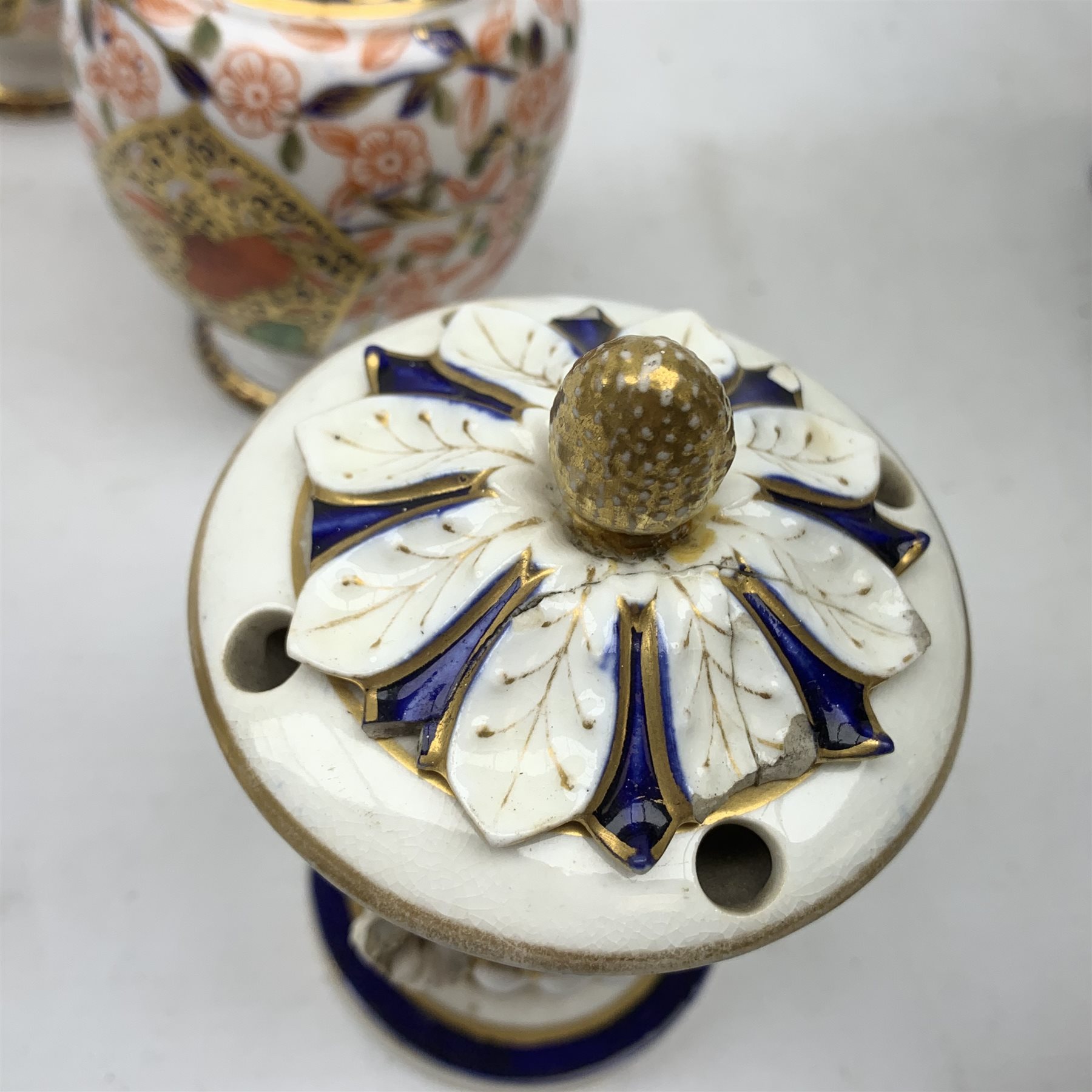 Three Bloor Derby Imari pattern twin handle urms, two examples with covers, each with mark beneath, H12cm, (all a/f), together with a pair of late 19th century Royal Crown Derby Imari pattern urns and covers, each with mark beneath, H13cm, (one significantly a/f). 