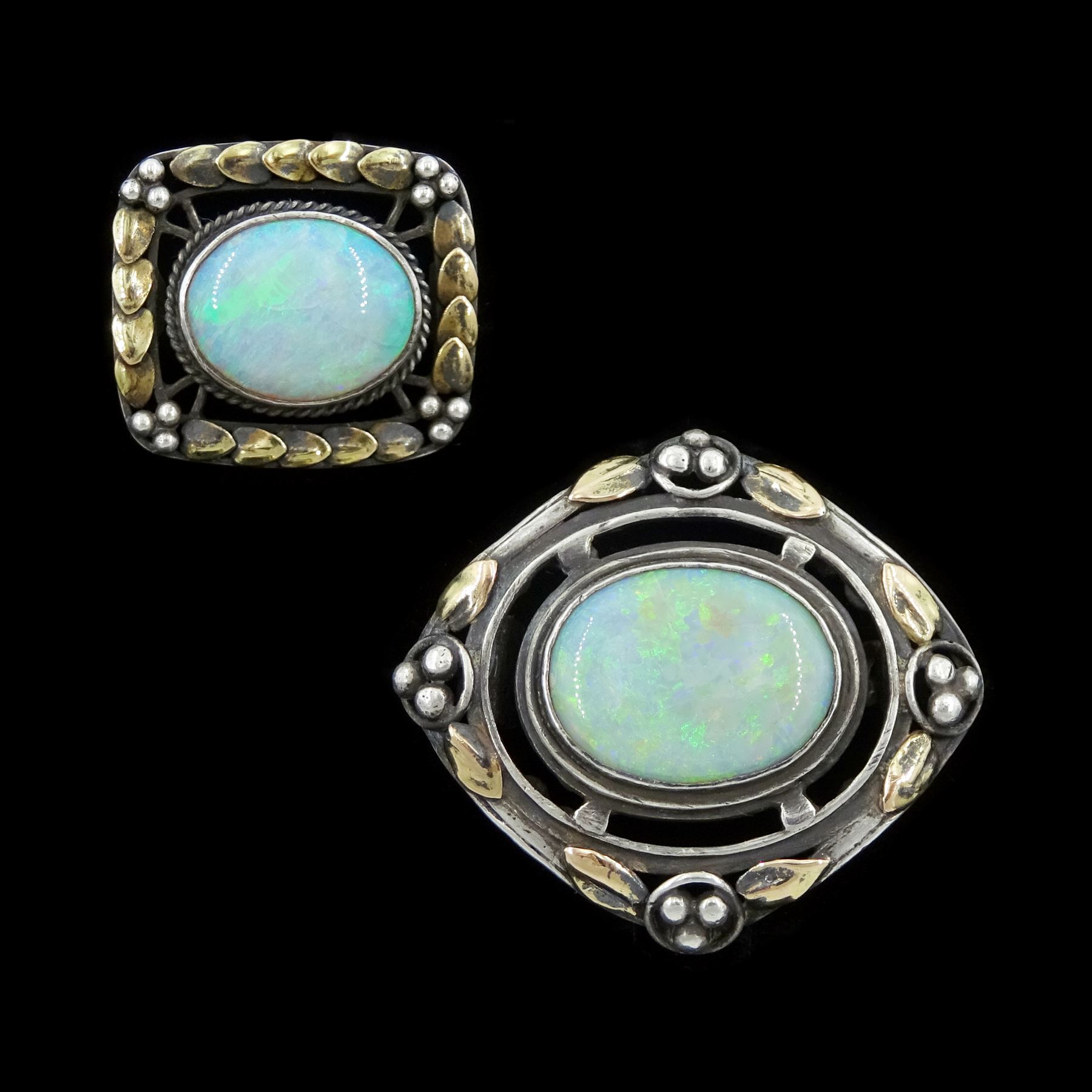 Two silver opal brooches