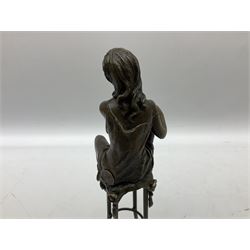 Art Deco style bronze modelled as a female figure, holding her knee, seated upon a chair, after 'Pierre Collinet', H28cm