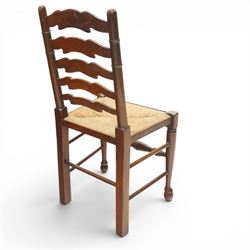 Set of six Lancashire country ladderback dining chairs with rush seats, raised on tapering supports with swell-turned stretcher