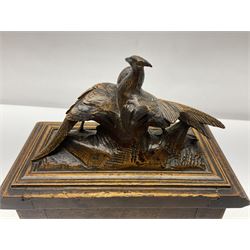 Carved wooden jewellery casket, the finial modelled as two grouse, each panel carved with flowers and leaves, opening to reveal compartmentalised interior, upon four feet, H26cm
