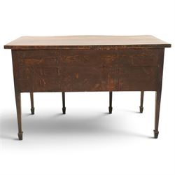 George III inlaid mahogany serpentine sideboard, the shaped top with crossbanding and satinwood stringing, fitted with central bow-front cock-beaded frieze drawer over a shaped apron inlaid with paterae, shell motifs and scrolling foliage, flanked by a deep right-hand drawer and two drawers to the left, raised on square tapering supports with spade feet