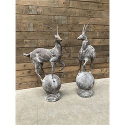 Pair of cast iron garden Stag figures or gate finials, raised on spherical ribbed base 