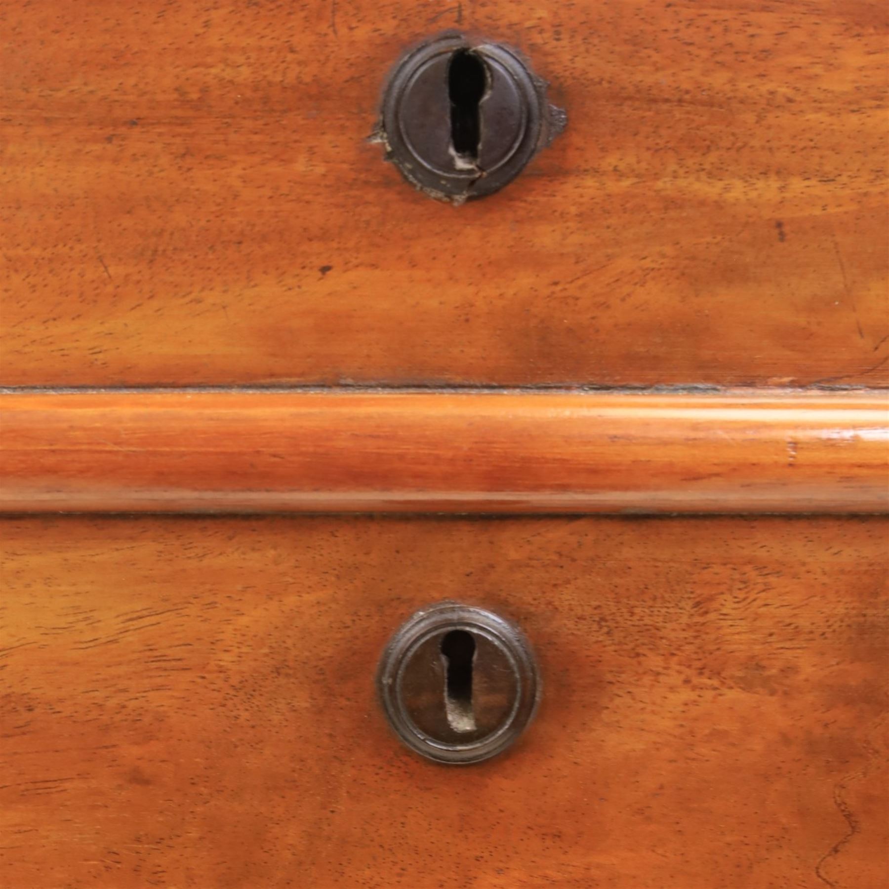 Victorian mahogany chest, with four long  flame mahogany fronted drawers with turned wooden knobs, raised on turned bun feet 
