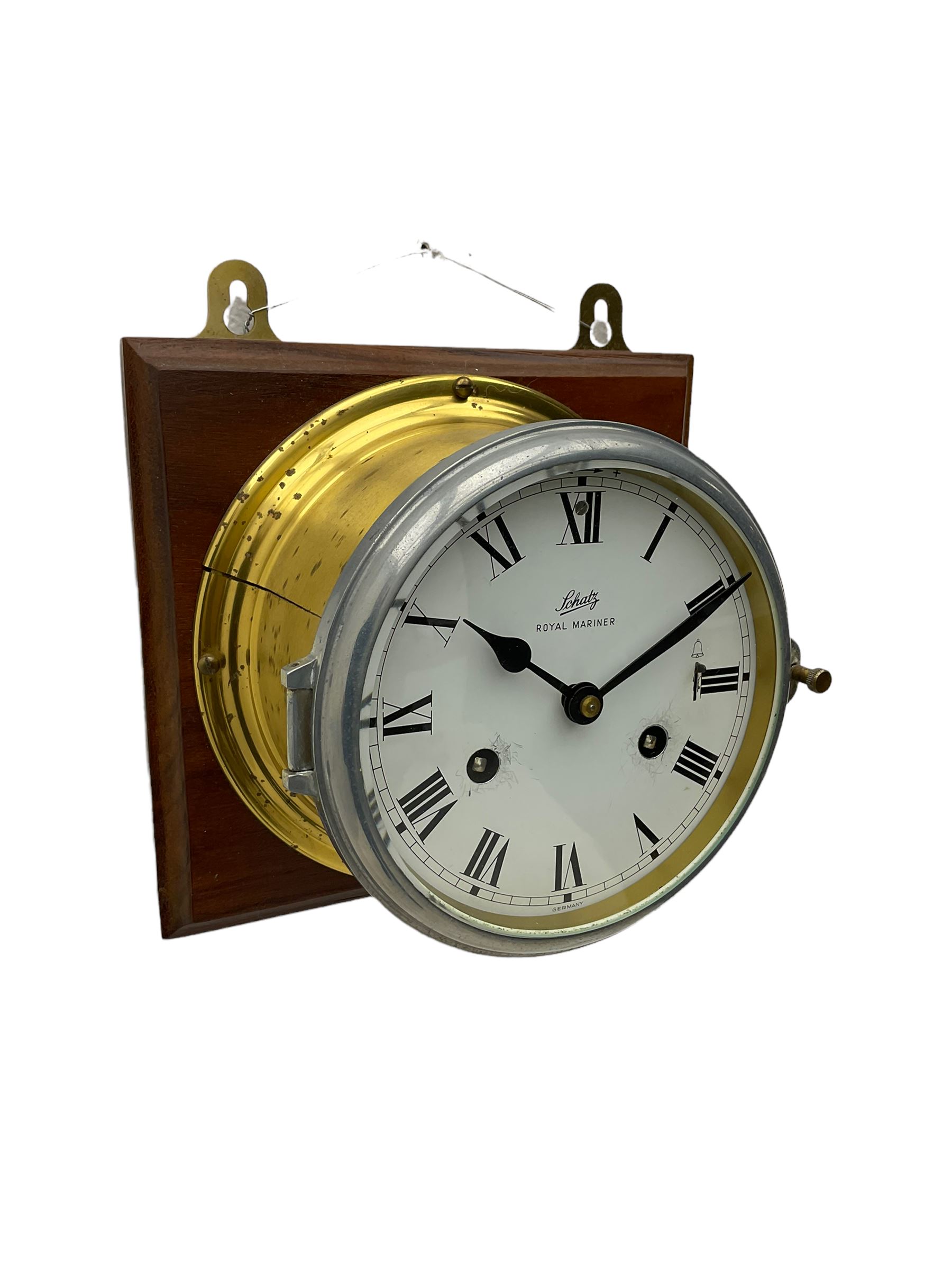 A compact German manufactured ships clock in a spun brass case with a 5