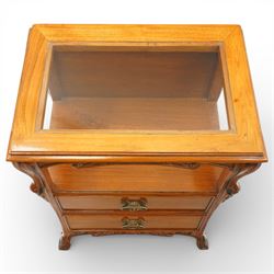 And So To Bed - pair of cherry wood and cane 'Libertine' bedside tables, glass top above a shaped and carved apron, with open recess above two drawers with brass handle, flanked by caned sides, raised on short cabriole supports 