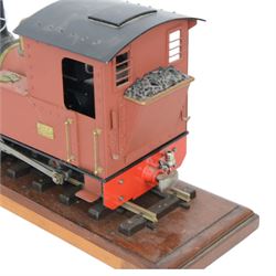 Roundhouse Gauge 1 remote controlled 0-4-0 tank locomotive, in red livery, on wooden plinth