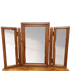 Willis & Gambier - mahogany dressing table, three part mirror and stool, the dressing table with rectangular top with chamfered corners, over two baize lined frieze drawers, kneehole recess and a single drawer either side, three part mirror with central tilting mirror on a moulded plinth base, with oval beige padded stool 