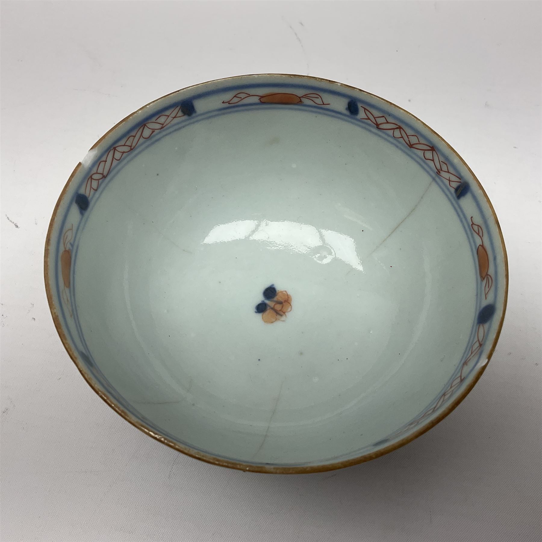 Chinese ceramic bowl, painted with floral and foliate decoration on a white ground, together with a similar much smaller Chinese bowl, painted with mountain scene to centre and covered by basket weave to exterior and a white metal mounted pear shaped scent bottle, largest bowl D11cm