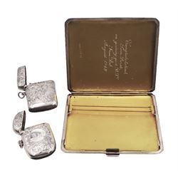 Mid 20th century silver cigarette case, with engine turned decoration and engraved initials to top corner and personal engraving to interior, hallmarked D Bros, Birmingham 1946, together with two Edwardian vesta cases, the first example engraved with C scroll decoration and monogrammed initals to bottom corner, hallmarked Arthur Barnett & Co Ltd, Birmingham 1907, the second example with engraved C scroll decoration and initialled central circular panel, hallmarked T Heatley, Birmingham 1906, approximate total weight 5.51 ozt (171.4 grams)