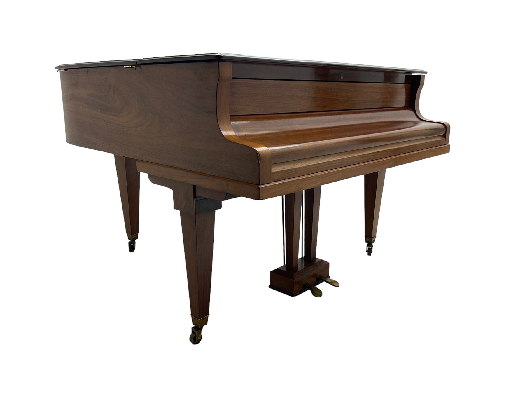  Antonin Petrof - Walnut overstrung baby grand piano, 7 0catve 85 key compass with original strings, tuning pins, damper felts and hammer heads, with roller keyboard action and iron frame, sustaining and una-corda pedals, sliding open lattice music desk, supported on square tapering legs with brass cups and castors, with inner ebonised key fall and ivorine label inscribed 'Supplied by Harrods, London'.