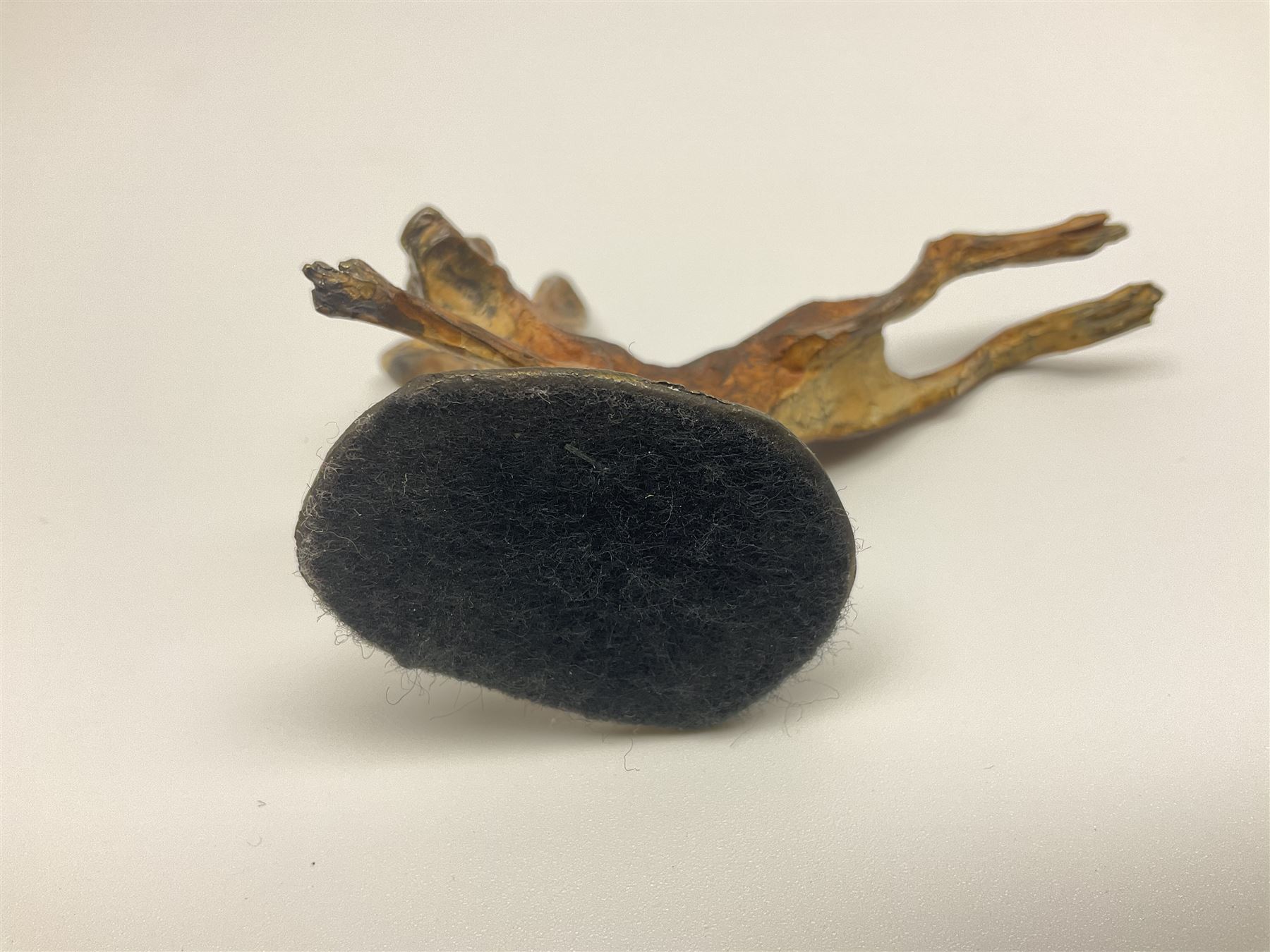 Michael Storey (British 1948-): 'Running Hare', bronze of a hare, H7cm, L10cm 