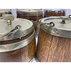 Five early 20th century biscuit barrels with silver-plated mounts