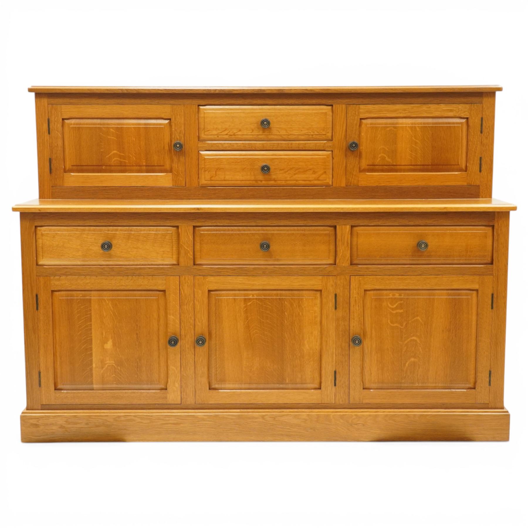Knightman - Yorkshire oak dresser, the upper section fitted with two drawers flanked by two hutch cupboards, rectangular top over three drawers and fielded panelled cupboard, on skirted base, carved with knight signature, by Horcace Knight of Thirsk