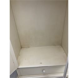 French design cream painted armoire wardrobe, shaped top with shell and flower head pediment, enclosed by two mirror glazed doors, the base fitted with single drawer