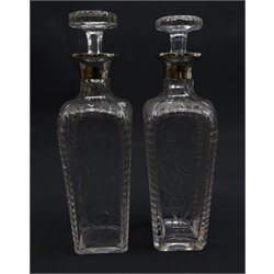  Pair Edwardian Thomas Webb & Sons silver mounted decanters, tapered square form engraved with stylized hops and barley, London 1902 and twenty-two similarly cut tumblers in three graduated sizes   