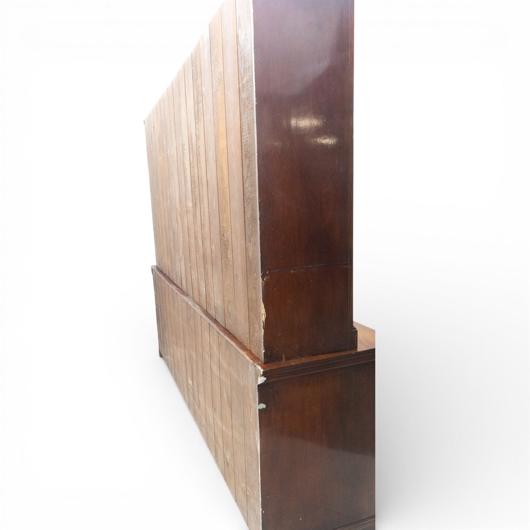 Late 19th century walnut library bookcase, fitted with four display doors with astragal bevelled panes, raised upon a four cupboard base with fielded panel doors